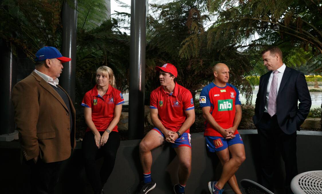 RED AND BLUE: Newcastle Knights chief executive officer Phil Gardner, Knights touch football representatives Ainsley Hughes and Alex Langbridge, Knights rugby league coach Nathan Brown and Touch Football Australia CEO Steve Mitchell gathered at Wests Mayfield on Monday. Picture: Max Mason-Hubers