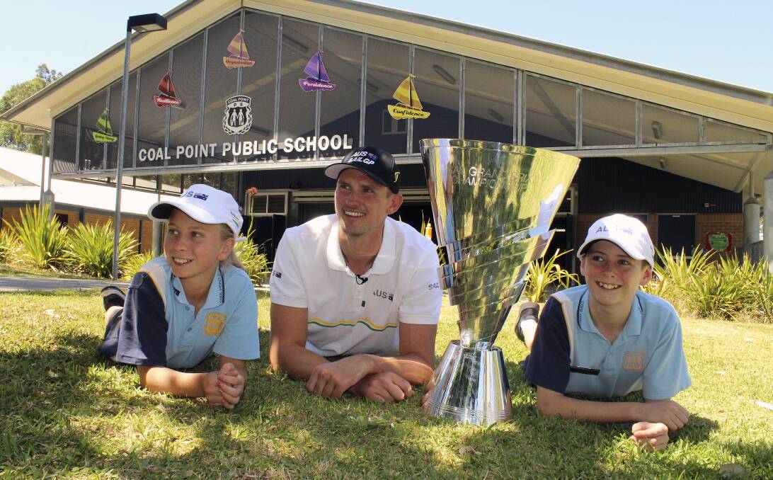 MEMORIES: Sail GP champion Kyle Langford (centre) visiting his former primary school at Coal Point on Friday with current students Amelia Ovenden and Cooper Atkinson. Picture: Josh Callinan