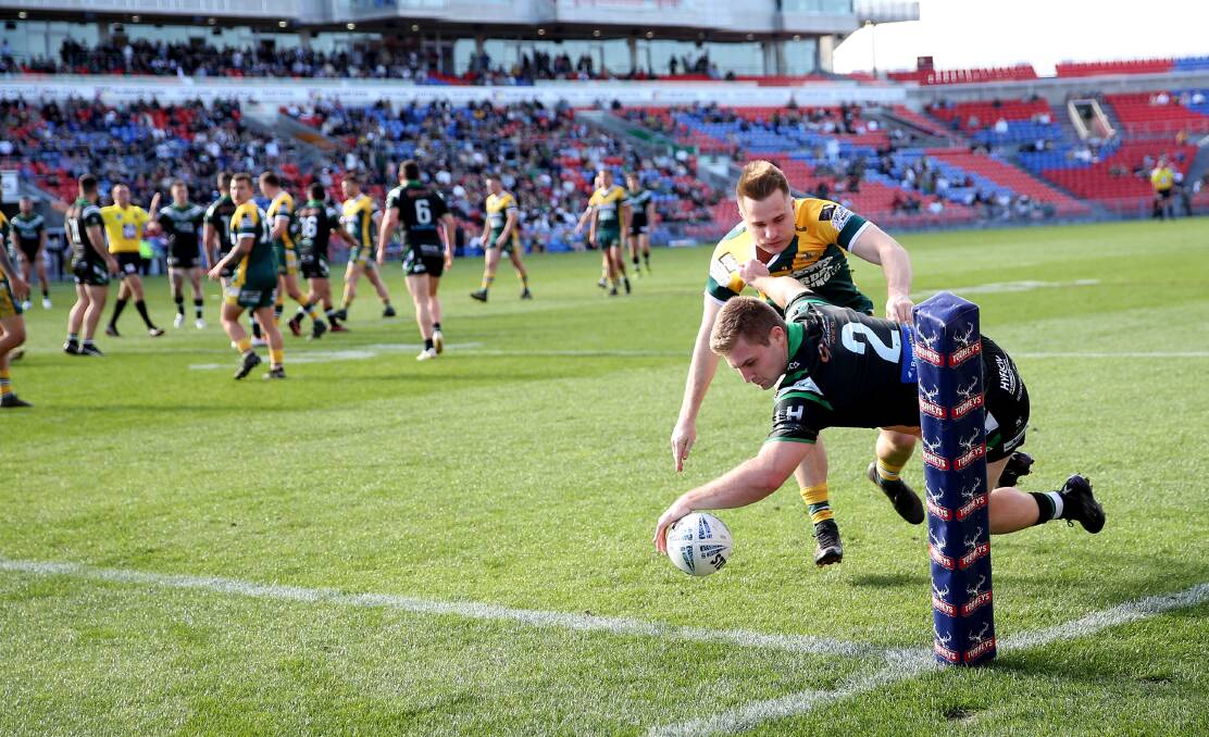 Maitland and Macquarie playing in last year's Newcastle RL grand final at McDonald Jones Stadium. Picture by Peter Lorimer