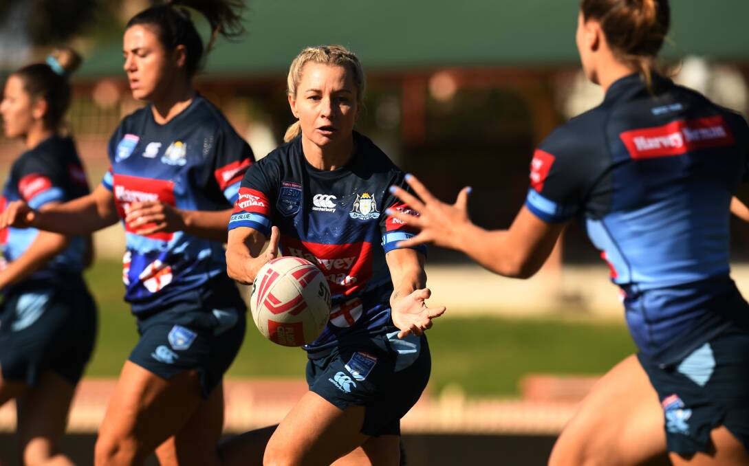 DIRECTION: CRL Newcastle's Kylie Hilder passes the ball to teammate Isabelle Kelly at NSW training in Sydney on Thursday. Picture: AAP