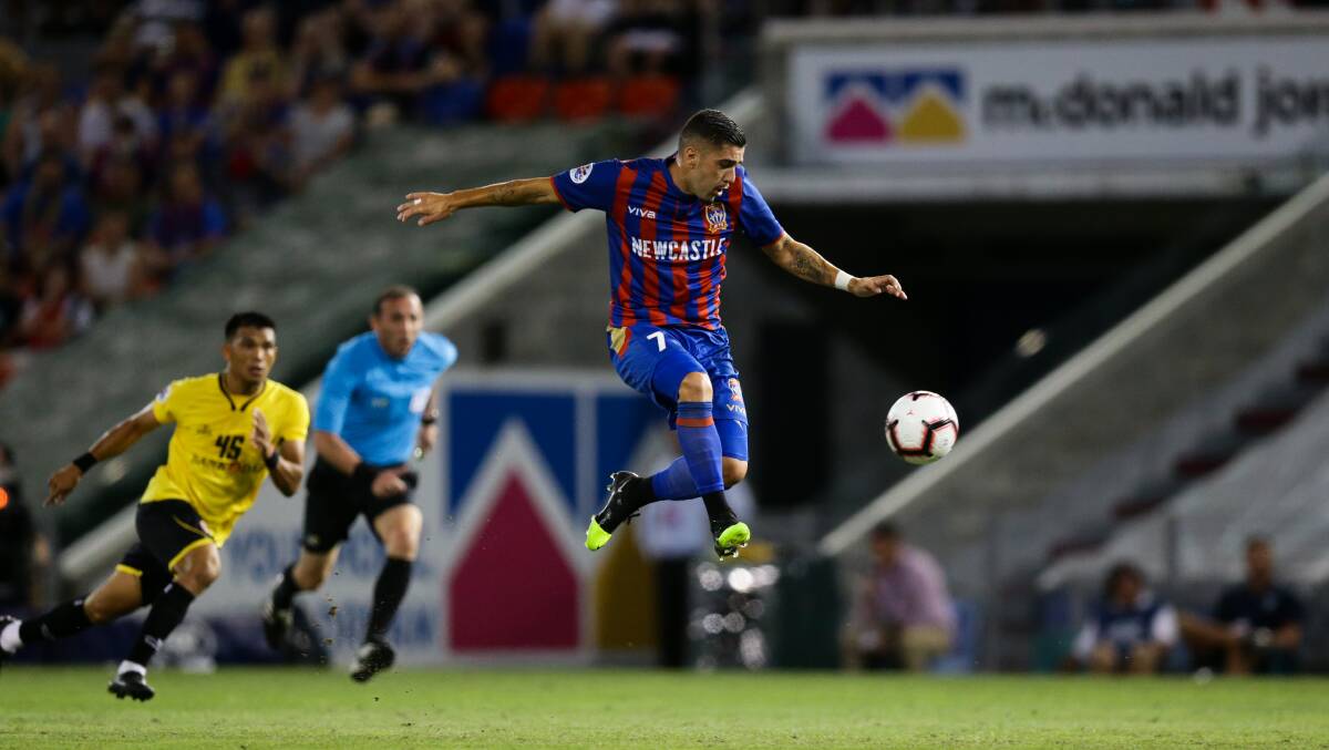 FLYING HIGH: Newcastle Jets player Dimi Petratos has been recalled to the Socceroos squad. Picture: Jonathan Carroll 