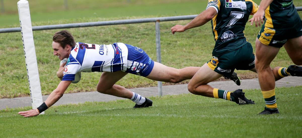 Central winger Kain Anderson crosses for a try in the corner last Newcastle RL season. Picture by Peter Lorimer