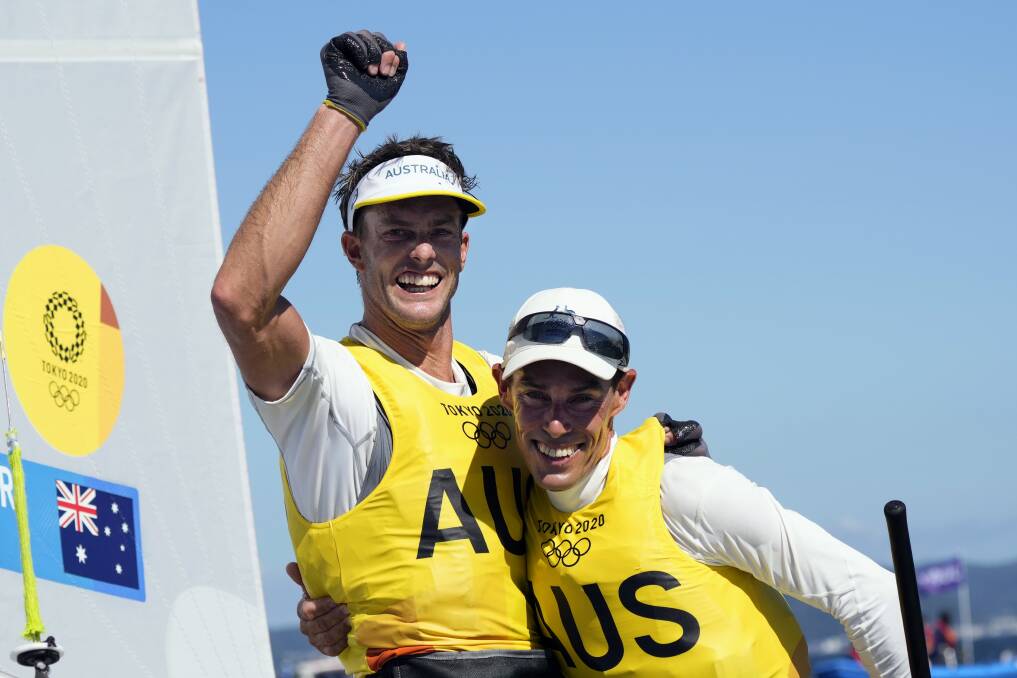 CHAMPIONS: Aussie sailors Will Ryan and Mat Belcher after claiming gold in the men's 470 at the Tokyo Olympics on Wednesday. Picture: AP Photo/Bernat Armangue