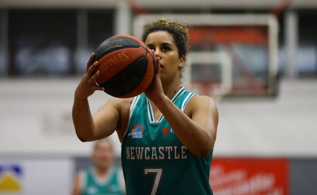 ON A ROLL: Hannah Young lines up a shot for the Newcastle Hunters in June. The 26-year-old has joined the Townsville Fire after claiming the WNBL championship with the University of Canberra Capitals. Picture: Jonathan Carroll