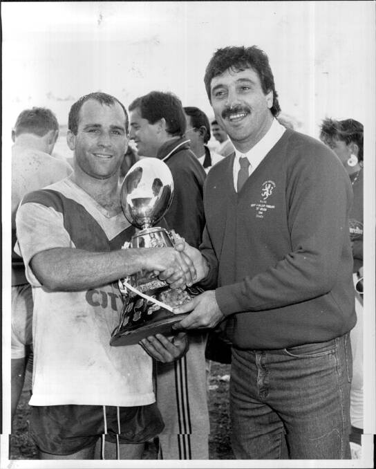 HAPPY DAYS: Captain Richard Jones and coach Paul Merlo with the Newcastle Rugby League premiership trophy after Souths beat Lakes in the 1988 grand final. Picture: Newcastle Herald archives