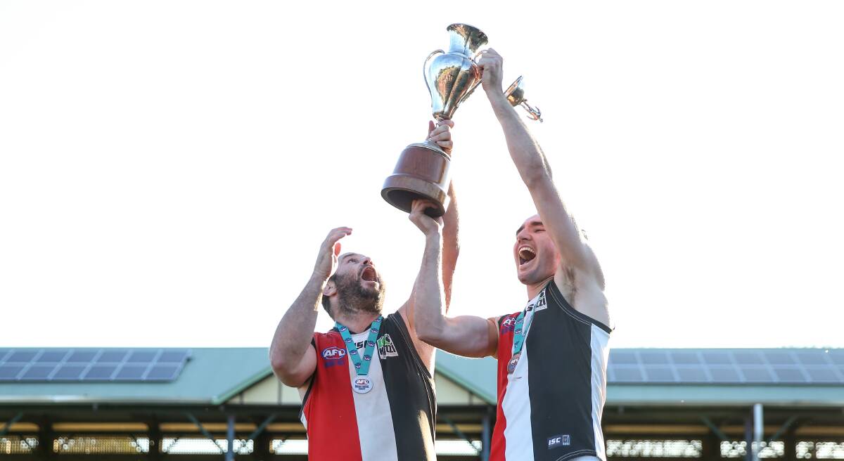 WATCH OUT: Terrigal Avoca leadership team, player-coach Chris Bishop and captain Kurt Fleming, lift the Black Diamond Cup at No.1 Sportsground on Saturday after a 10-point grand final win over Newcastle City. Picture: Marina Neil