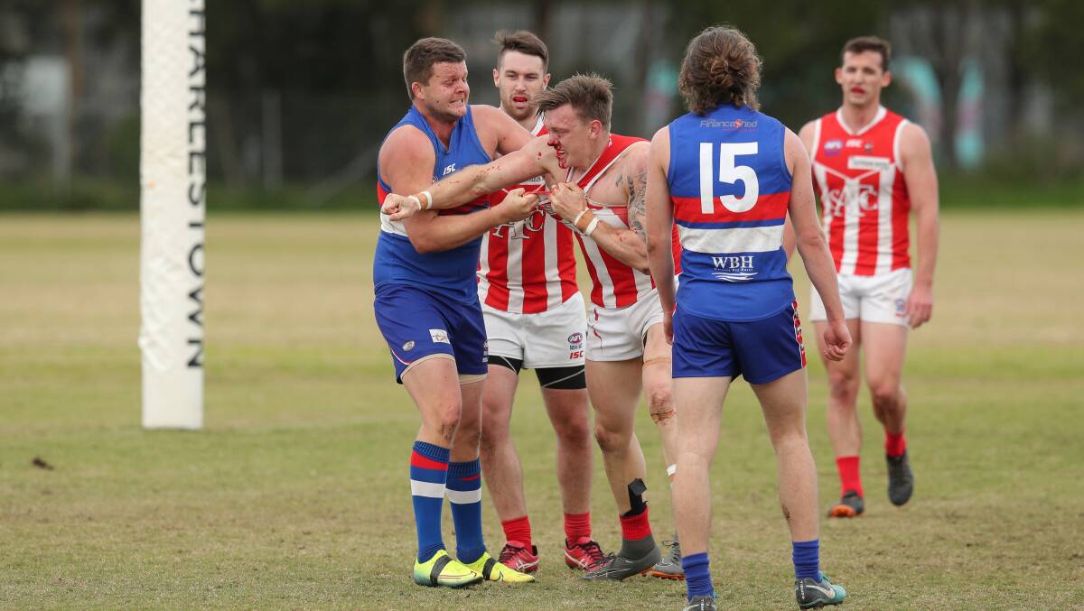 CASES TO ANSWER: Warners Bay's Jake Roach and Singleton's Kurtis Olsen during Saturday's season opener at Feighan Oval. Picture: Max Mason-Hubers