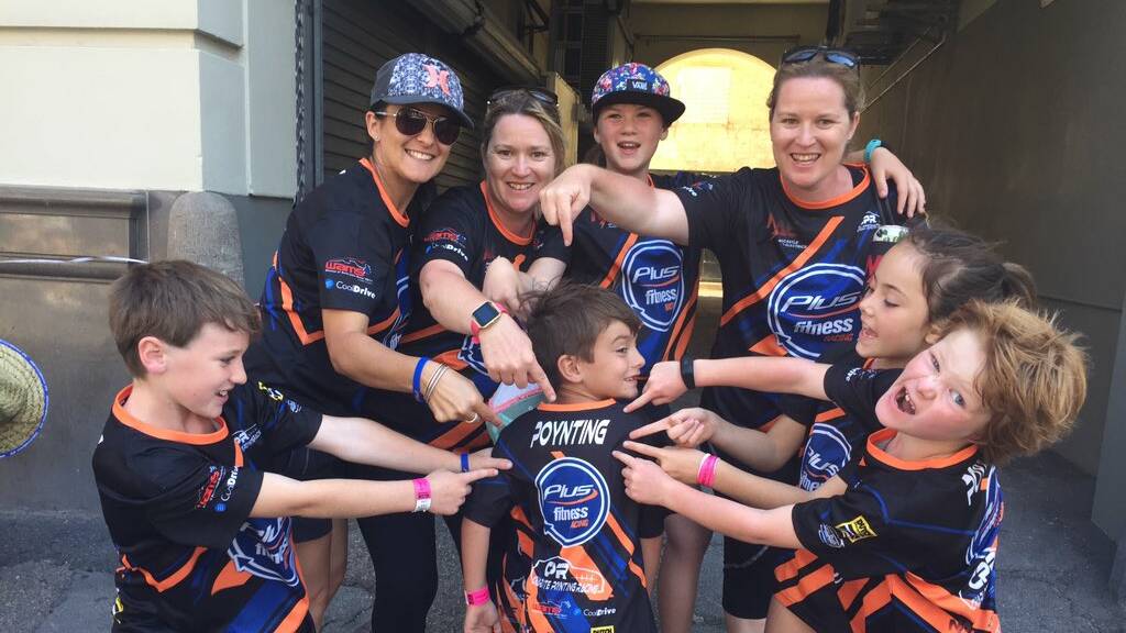 FANS: Friends, family and supporters of Charlotte Poynting trackside at Newcastle Supercars on Friday afternoon. Picture: Josh Callinan