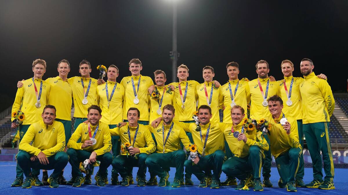 SECOND: Norths defender Matt Dawson (back row, far left) with the Kookaburras after being presented silver medals at the Tokyo Olympics on Thursday night. Picture: AAP Image/Joe Giddens