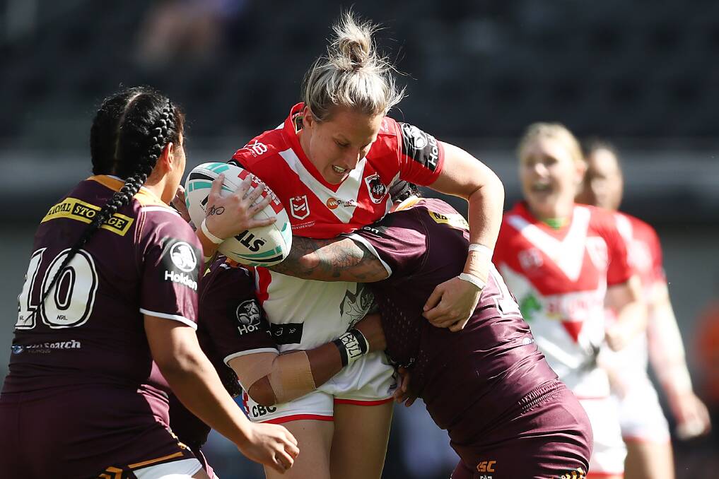 ON THE CHARGE: St George Illawarra Dragons lock Holli Wheeler, who lives at Wallsend, takes the ball up last month against upcoming NRLW grand final opponents and defending champions the Brisbane Broncos. Picture: Getty Images 