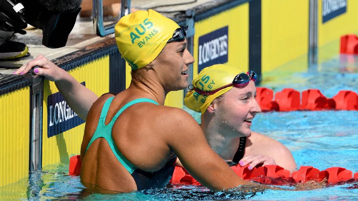 HOME: Newcastle swimmer Meg Bailey (right). Picture: AAP