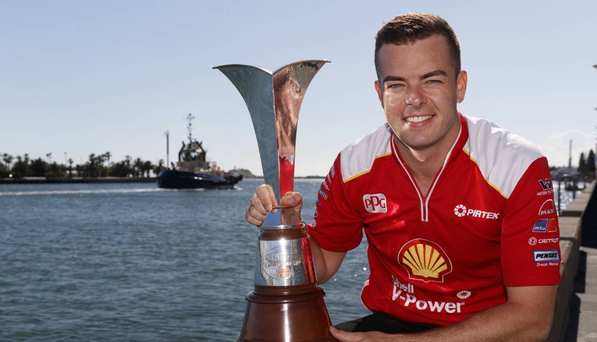 SWEET VICTORY: Scott McLaughlin with the Supercars championship trophy in Newcastle on Monday morning. Picture: Mark Horsburgh