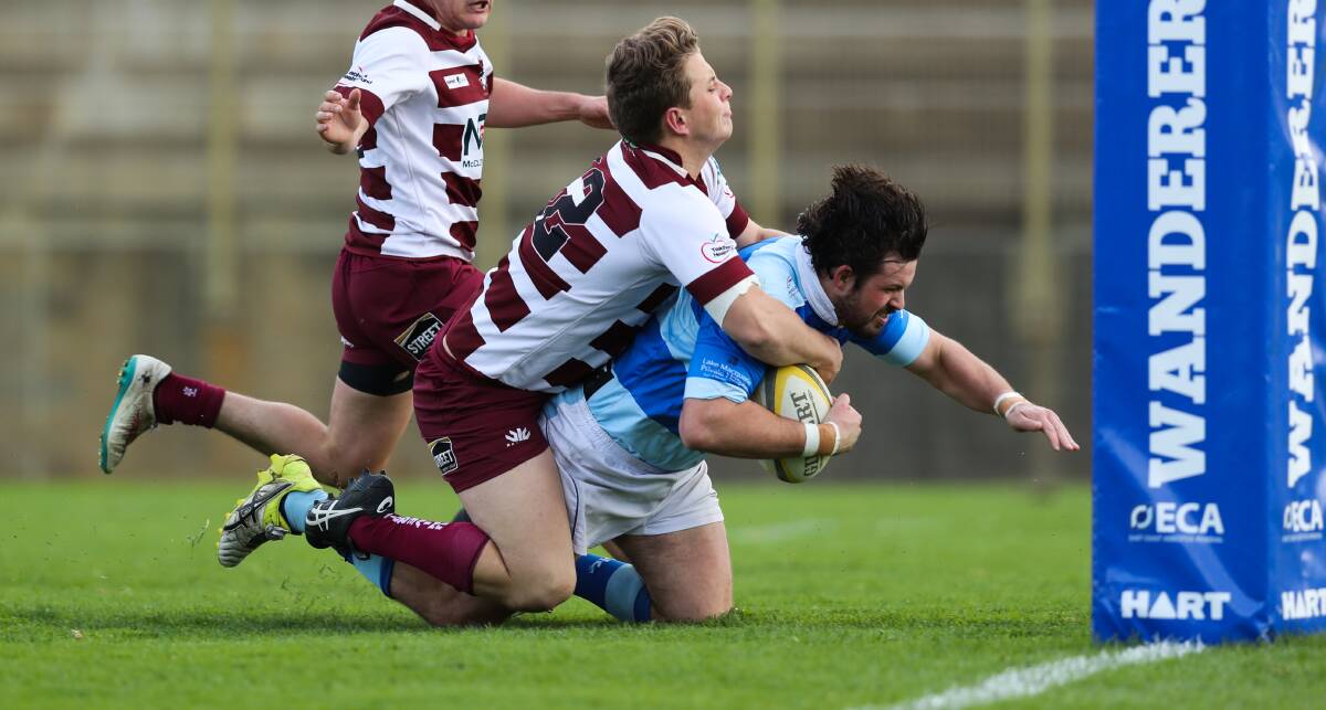 FORM: University captain Danny Murch scoring a try last season for former club Wanderers. The 29-year-old joined The Students in 2019 after five campaigns with the Two Blues. Picture: Jonathan Carroll