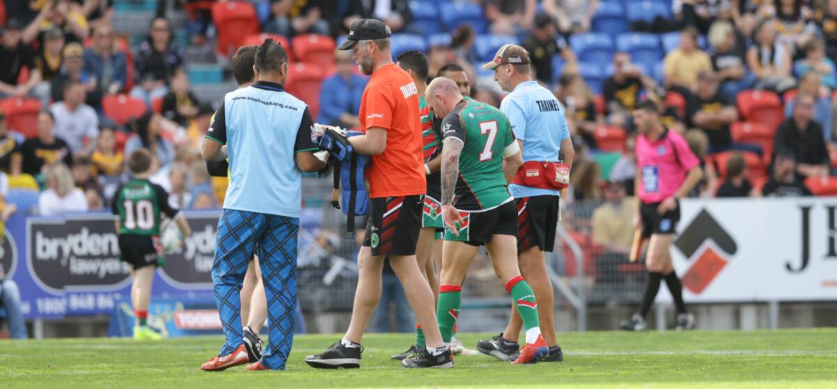 OFF: Luke Walsh (No.7) being helped from the field during last month's grand final. Picture: Jonathan Carroll