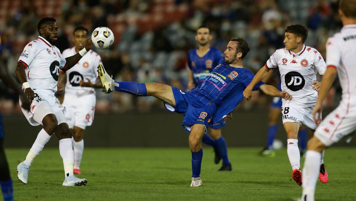 TOUCH: Angus Thurgate playing for the Newcastle Jets last month. Picture: Jonathan Carroll