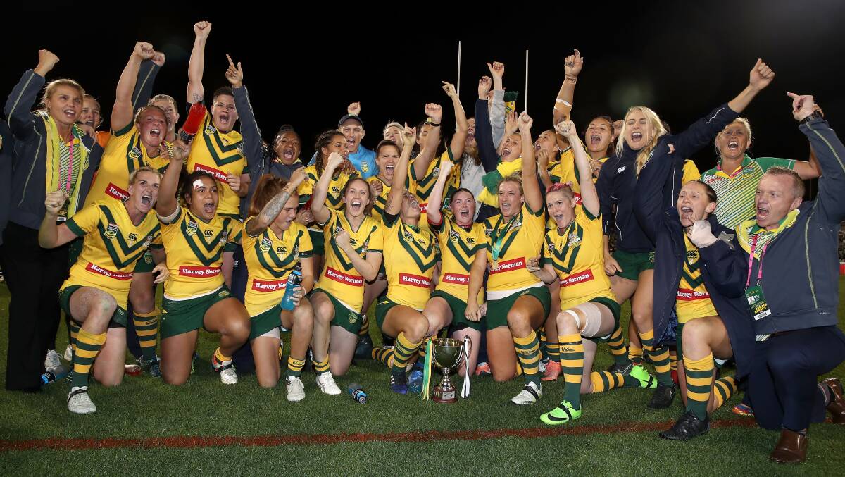 TRIUMPH: North Newcastle trio Bec Young, Caitlin Moran and Simone Smith celebrate after the Jillaroos' 16-4 victory over the Kiwi Ferns in Canberra on Friday. Picture: Getty Images.