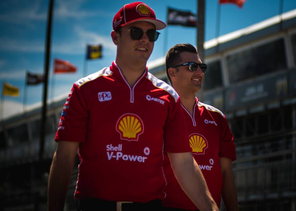 TEAMMATES: Supercars drivers Scott McLaughlin and Fabian Coulthard in the Newcastle 500 home straight on Tuesday. Track construction continues ahead of next week's season-ending race. Picture: Simon McCarthy  