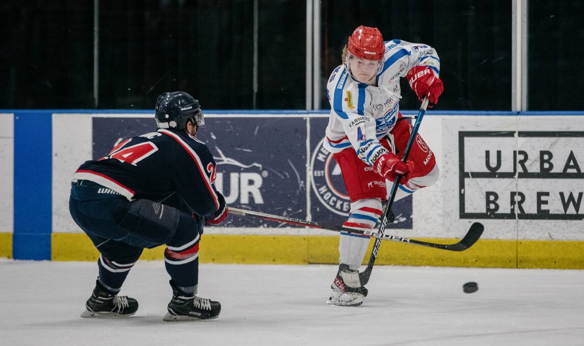 BATTLE: Riley Tonks (right) playing for the Newcastle Northstars against the Ice in Melbourne on Saturday. The Novocastrians lost in overtime before bouncing back against the Mustangs on Sunday. Picture: AK Hockey Shots