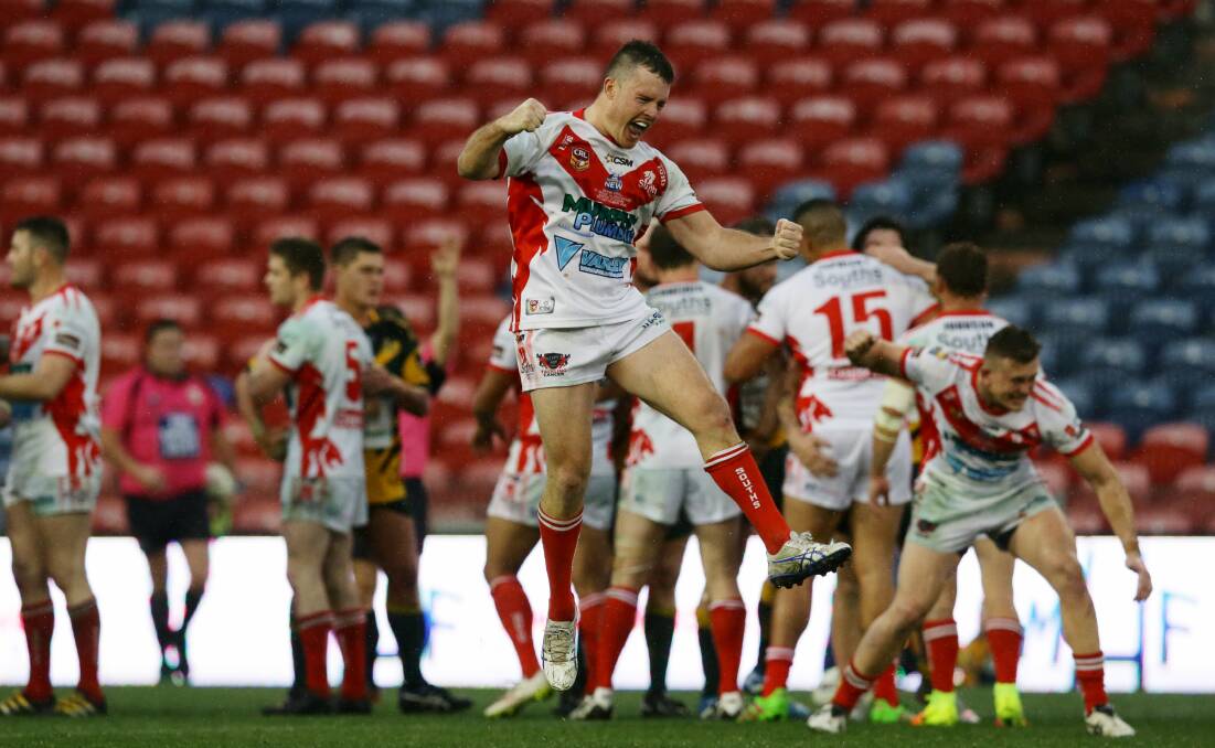 JUMP FOR JOY: Macquarie hooker Liam Higgins celebrates after helping former club Souths win the 2016 Newcastle Rugby League grand final. Picture: Jonathan Carroll