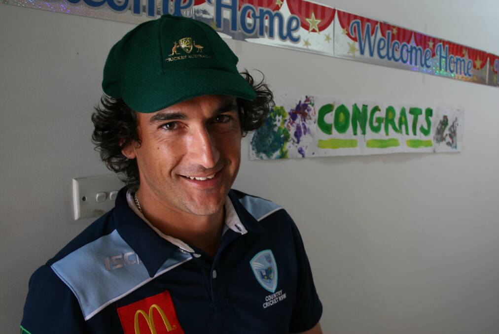 WELCOME: Joseph Price with his Australian Country cap at home in Adamstown on Monday. Picture: Josh Callinan