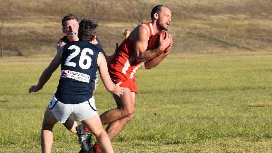 EXPERIENCE: Roosters midfielder Andrew Scott playing against City last year. Picture: Singleton Argus