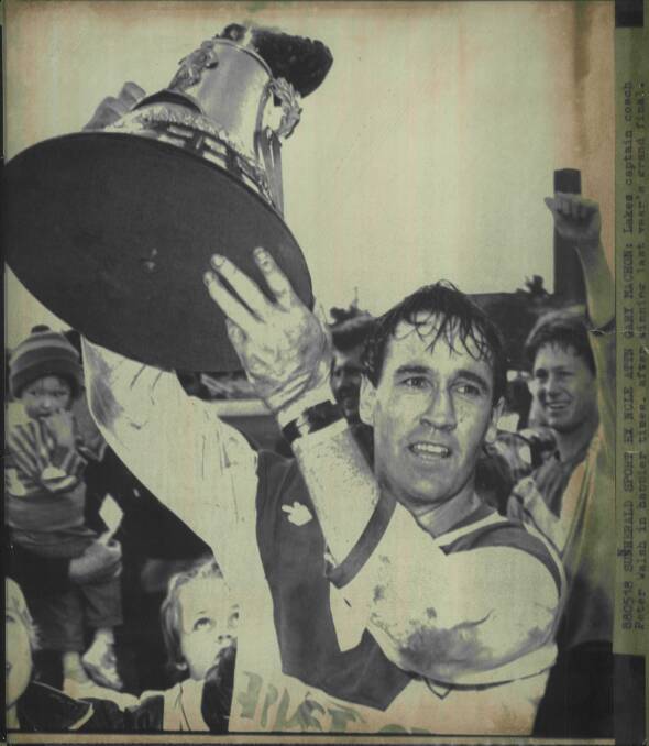 SUCCESS: Lakes captain-coach Peter Walsh with the premiership trophy in 1987. Picture: Newcastle Herald archives.