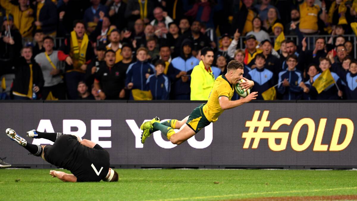 IN: Wallabies halfback Nic White scores a try against the All Blacks during the recent Bledisloe Cup series. Picture: AAP