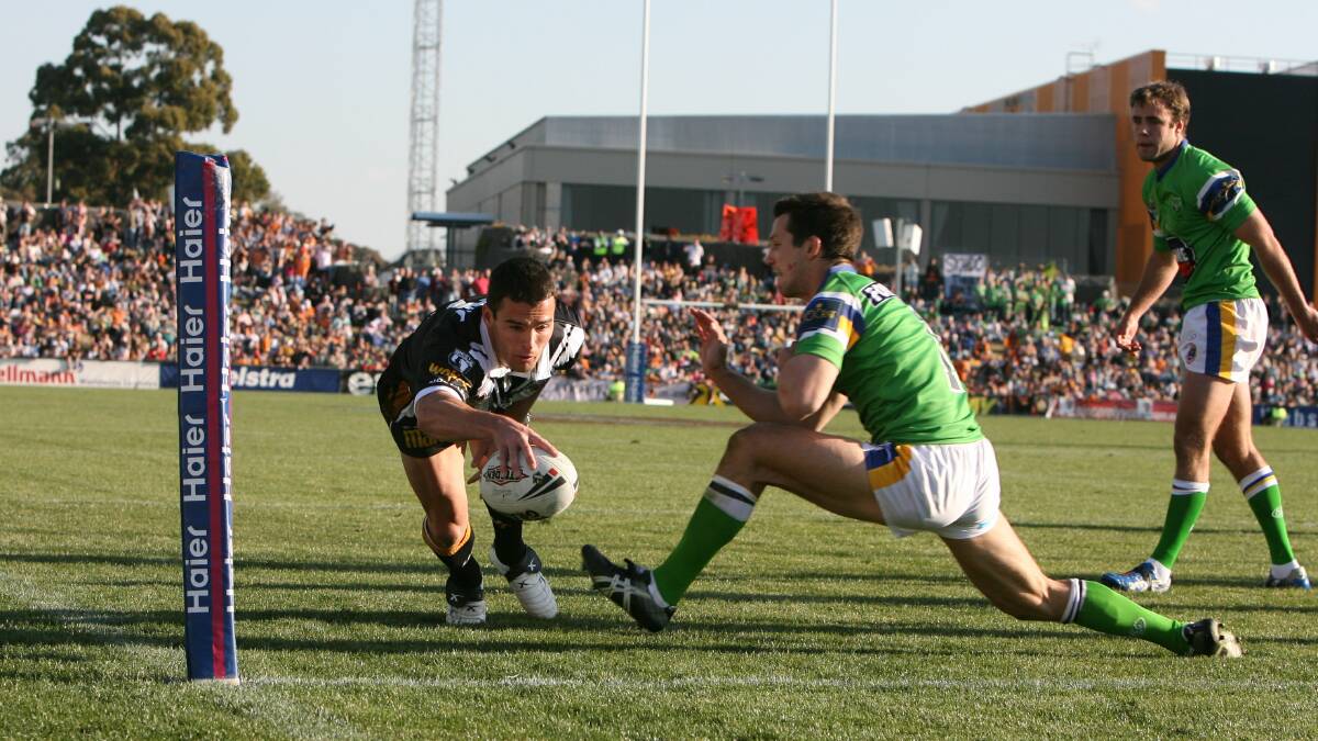 LEAD: Newcastle second-division under-23 coach Daniel Fitzhenry scoring a try for the Wests Tigers against Canberra at Campbelltown in 2006. Picture: Craig Golding 