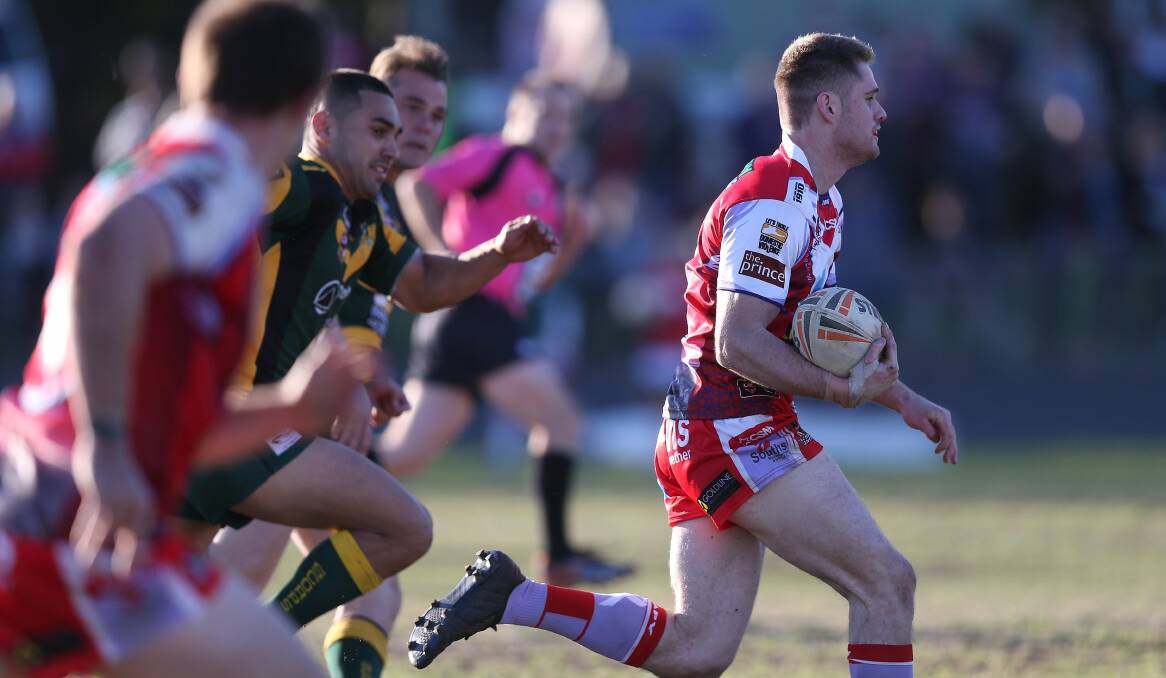 FLASH: South Newcastle winger Jarrod Flannagan streaks ahead of his Macquarie opponents on what was a significant, successful and emotional afternoon for Lions supporters at Townson Oval on Saturday. Picture: Marina Neil.
 