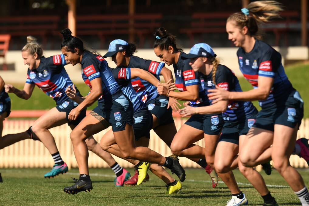 ON THE RUN: The NSW women's Origin squad during their captain's run at North Sydney Oval on Thursday. Picture: AAP