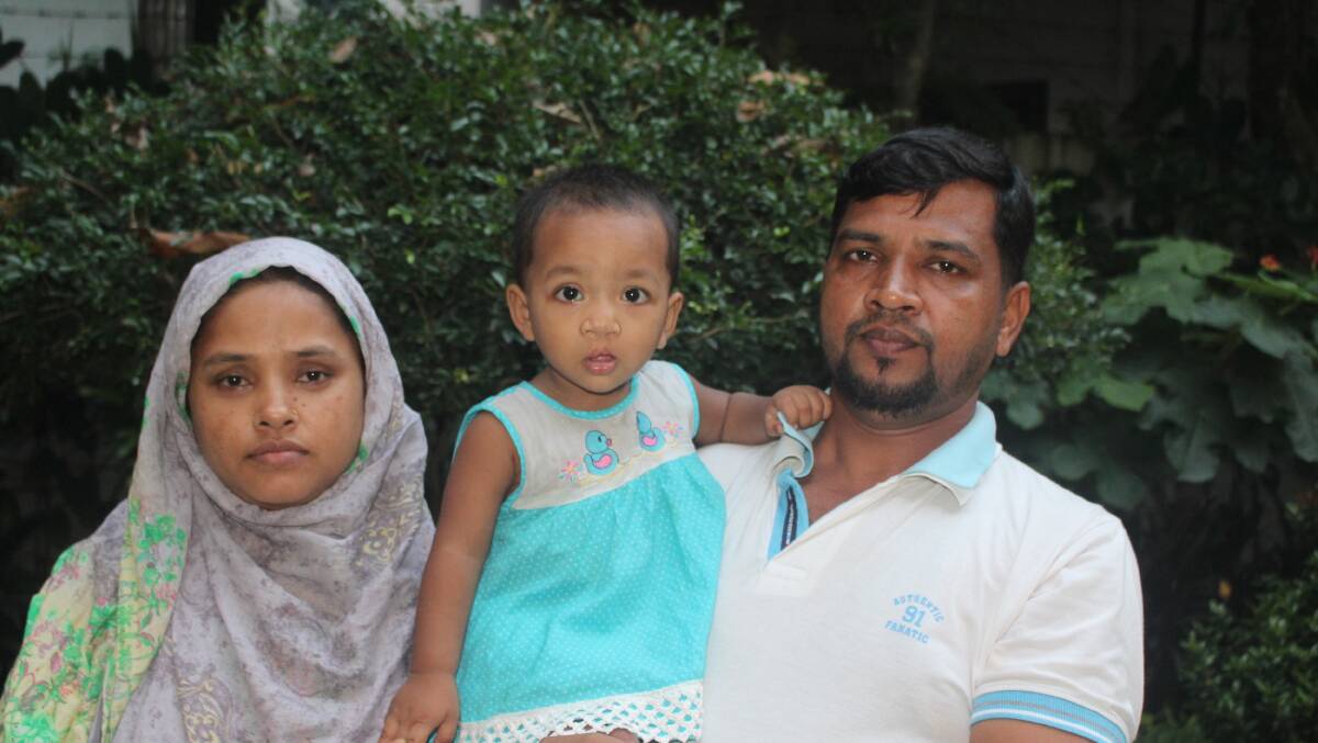 A much brighter future: Saber and Ferdowshi with their daughter Tahpin, who underwent surgery on her cleft lip and palate.