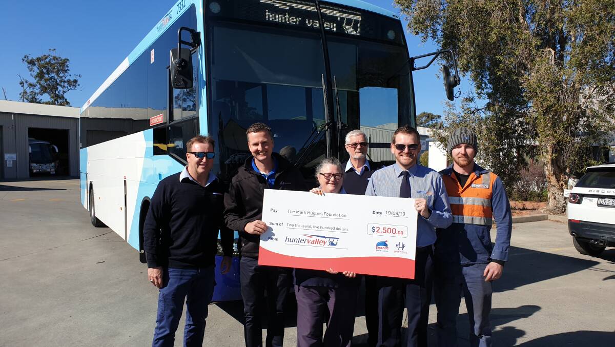 GENEROUS DONATION: Hunter Valley Buses donated a $2500 check to the Mark Hughes Foundation on Monday morning.