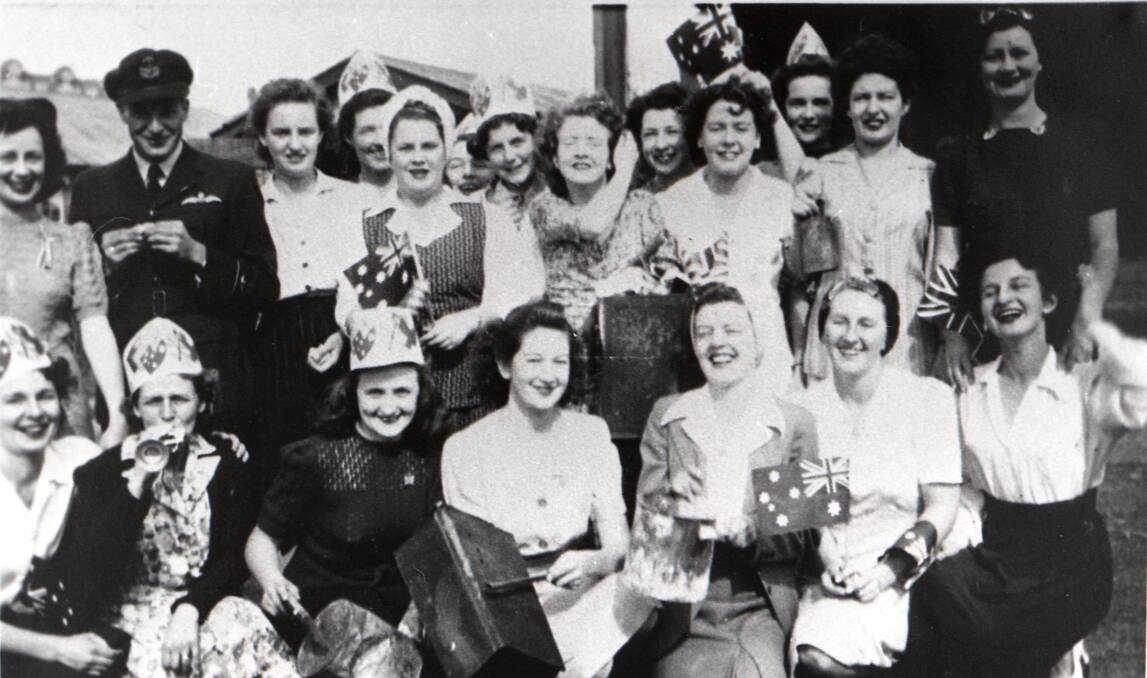 PORT KEMBLA CELEBRATES VP DAY: Back left to right: Lorna Monaghan, Allan Monaghan, Kitty Robertson, Jean Doyle, Margaret Moore, Elaine Davidson, Fay Pascoe, Avis Brewer, Joyce Brown, Marge Lamont, Eva Pascoe, Joyce Harris. Front: Rita McLaine, Betty Narbeth, Muriel Woolmer, Ms Duncan, June Pascoe, Betty Underwood, Olive Carman.Picture from the collections of the Wollongong City Libraries and the Illawarra Historical Society.