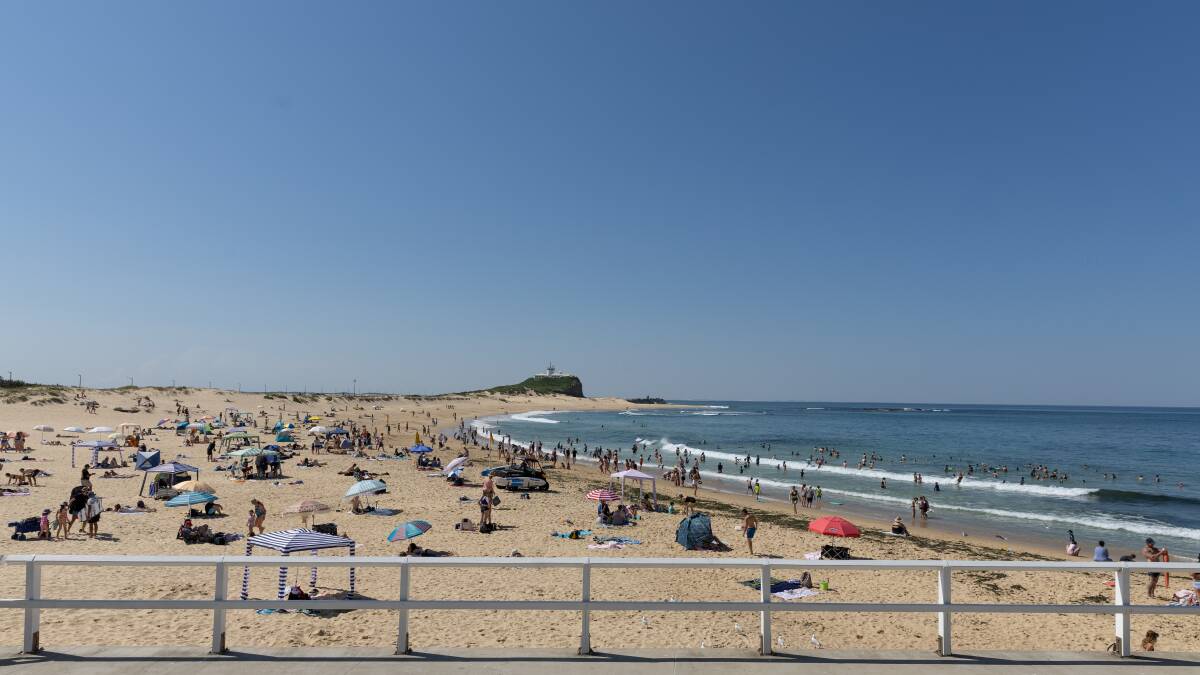 Locals headed to Nobby's Beach to cool off on Sunday. Picture by Marina Neil 