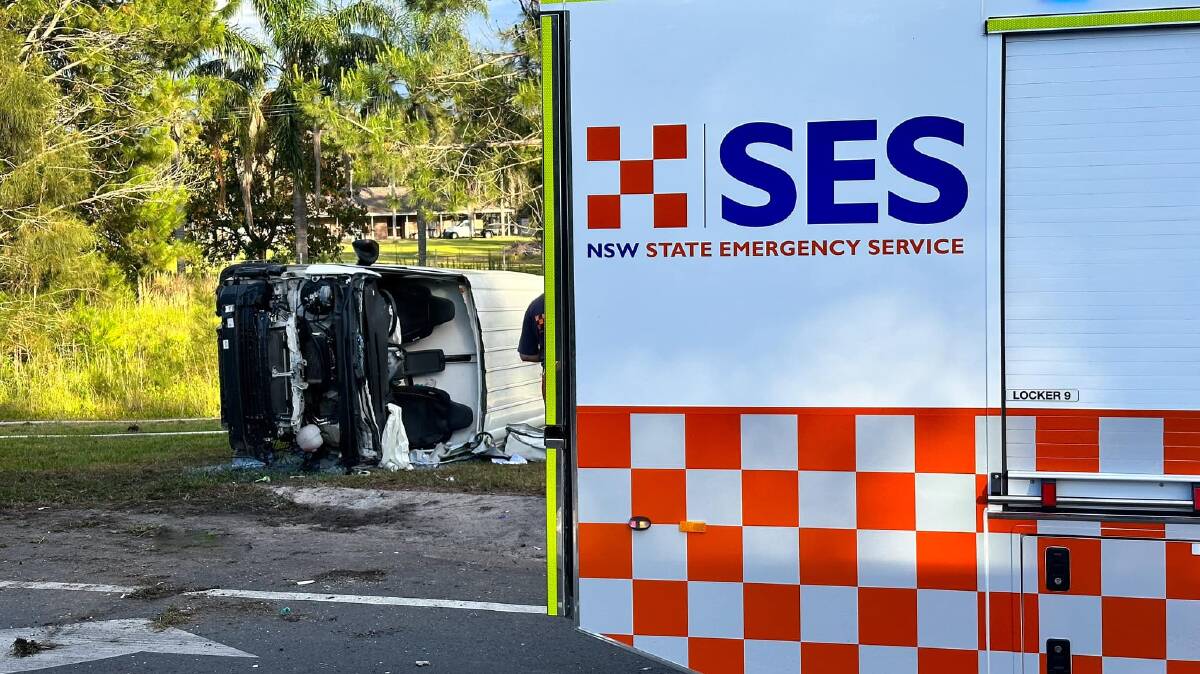 The driver of a van which crashed into a power pole before flipping on its side has been taken to hospital. Picture: Port Stephens SES