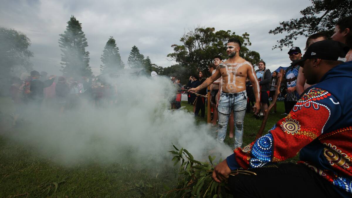 A smoking ceremony at a reconciliation walk in Lake Macquarie last year. Picture by Simone De Peak 