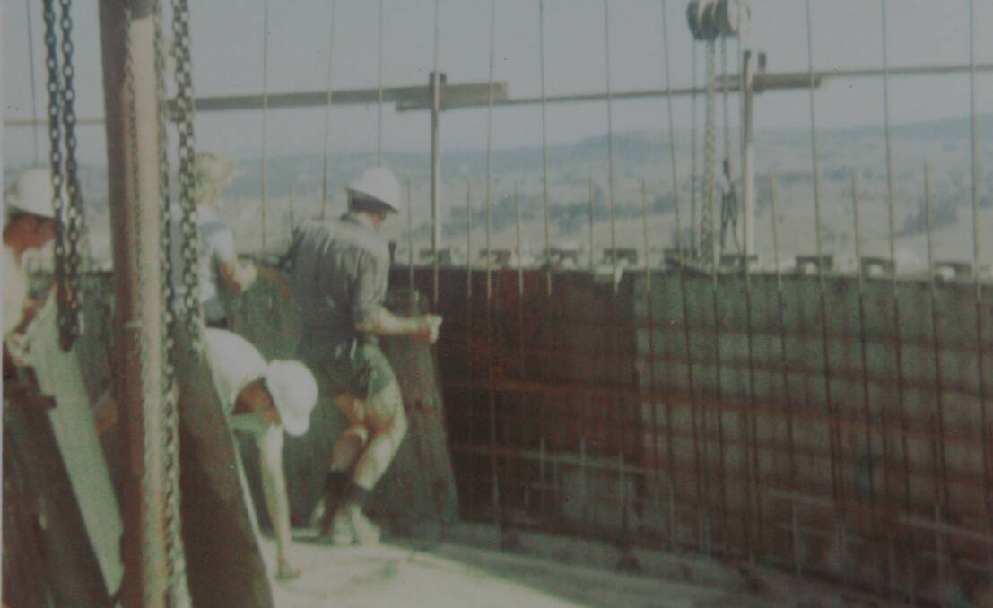 Mr Hogan's Tileman Australia colleagues building the towering structures in the late 1960s. Picture supplied 