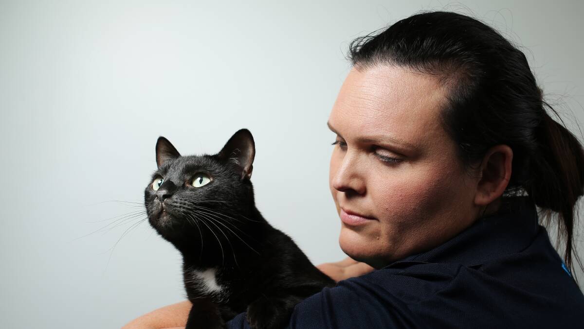 RSPCA Hunter shelter supervisor Emilie Hayes with Smurf the cat, who is looking for adoption. Picture by Simone De Peak 