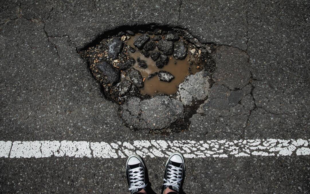 A pothole on Chinchen Street at Islington. Wet weather has caused significant damage to local roads across the Hunter. Picture by Marina Neil.