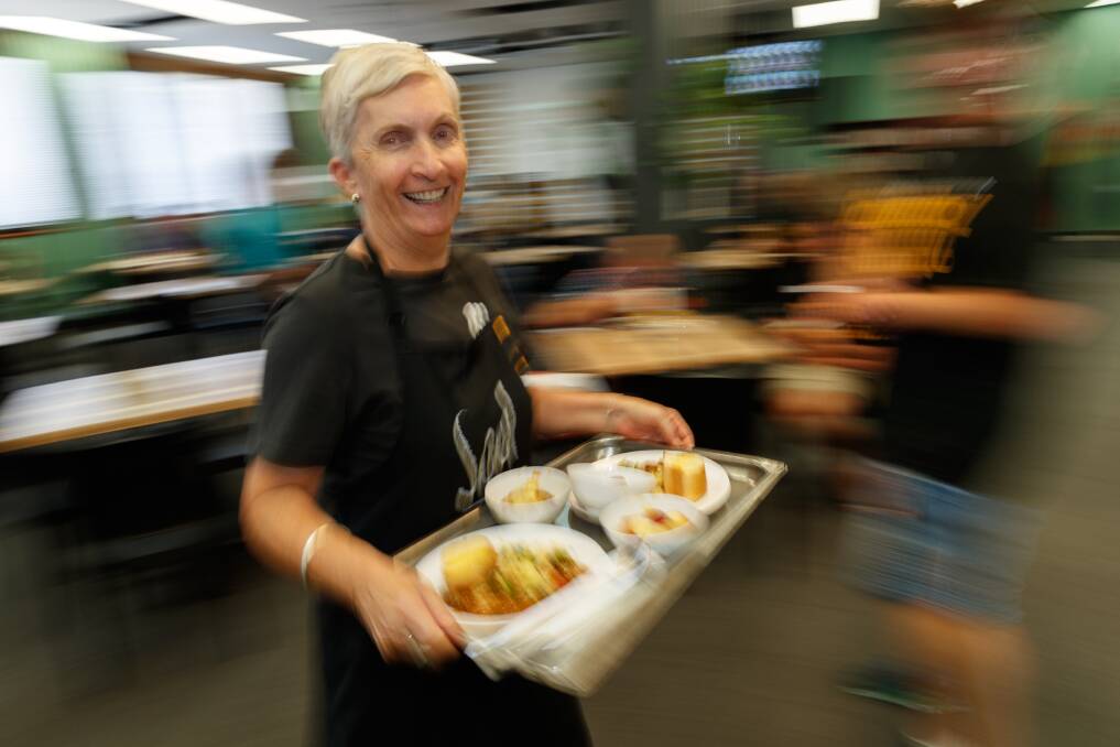 Soul Hub volunteer Debbie Mason serves up lunch on Thursday. Picture by Max Mason-Hubers.