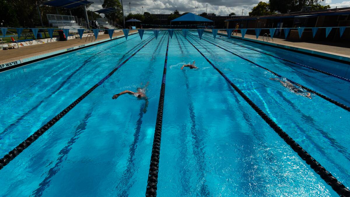 Swimmers at Mayfield Pool in March. Picture by Jonathan Carroll 