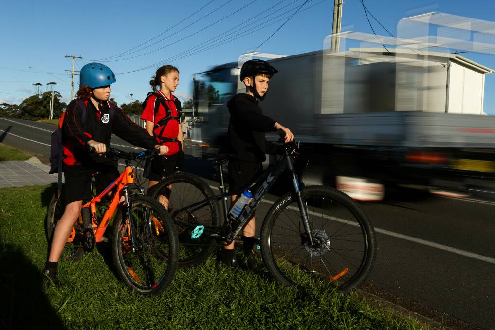 NO CROSSING: Dudley Public School students Sam Nugus, Barnaby Hackney and Bernie Forsyth try to cross Ocean Street on their way home from school. Picture: Jonathan Carroll