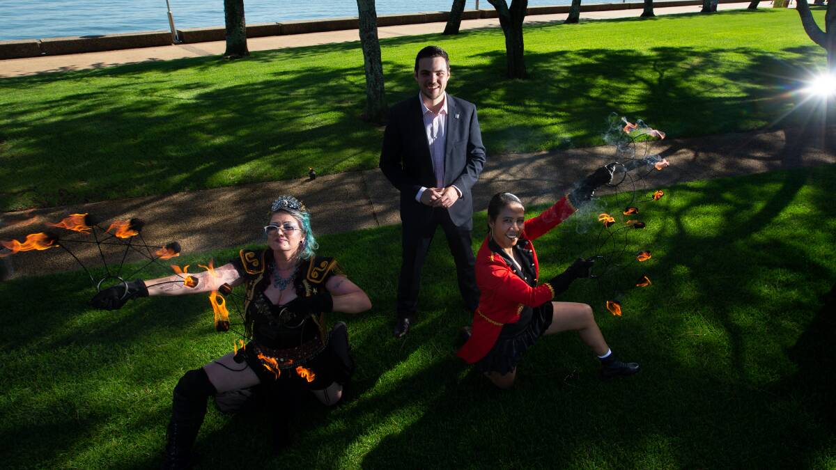 City of Newcastle deputy mayor Declan Clausen with Ifritah fire dancers. Picture by Jonathan Carroll 