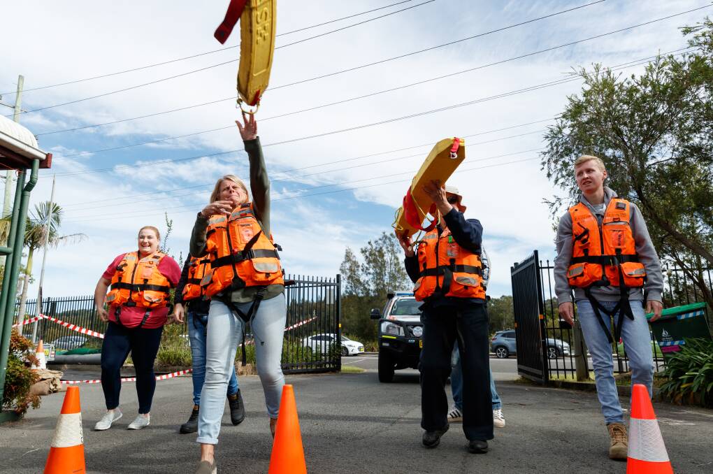 ORANGE FAMILY: Lake Macquarie SES new recruits training for a water rescue at the Boolaroo headquarters. Photo: Max Mason-Hubers