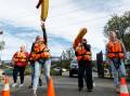 ORANGE FAMILY: Lake Macquarie SES new recruits training for a water rescue at the Boolaroo headquarters. Photo: Max Mason-Hubers