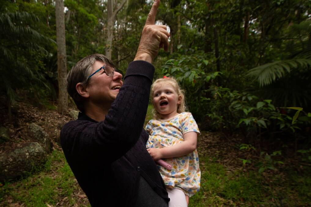 Maya Guest with her granddaughter Ellie, 2, spotting birds on her property in Lake Macquarie. Picture supplied.