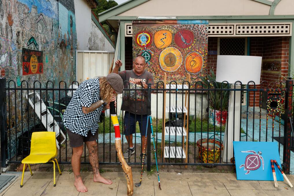 Uncle Billy, an indigenous Wiradjuri artist, chats with a local outside his home in Carrington. Picture by Max Mason-Hubers.