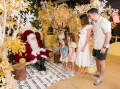 Stockland Green Hills is offering shoppers the chance to win huge prizes, save at sales, enjoy free family festivities, have their gifts wrapped and even have family photos taken with Santa. Picture Stockland Green Hills, featuring Belinda Guerra and family