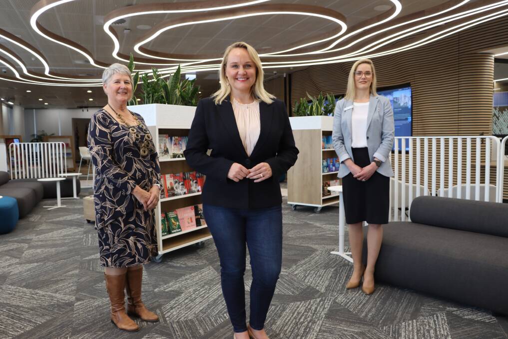 City of Newcastle's manager libraries and learning Suzie Gately, lord mayor Nuatali Nelmes and manager customer experience Deborah Moldrich inside the new digital library and customer service centre. 