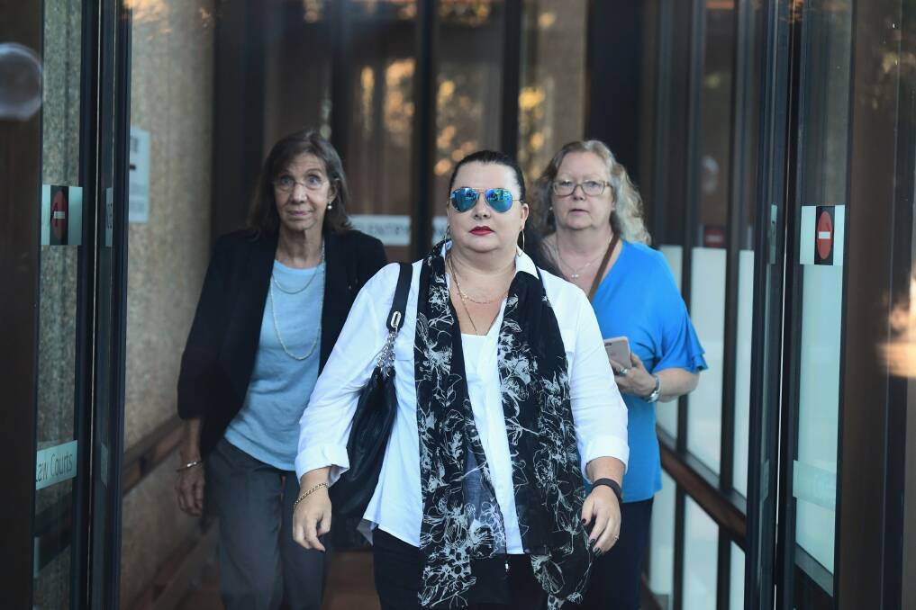 'IT'S WRONG': Michelle William, the sister of Christoper Greenfield, (left) Raymond James' daughter Tracy James (centre) and sister Marlaine Smith leaving the NSW Supreme Court in April. 